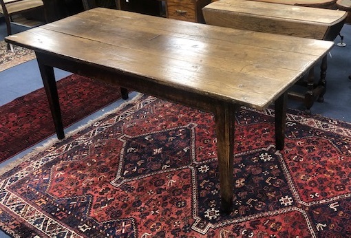 A late 18th/early 19th century oak plank top kitchen table length 198cm